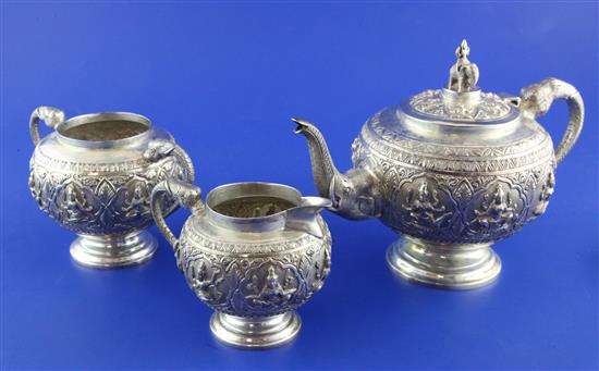 An early 20th century Indian silver three piece tea set, gross 23 oz.